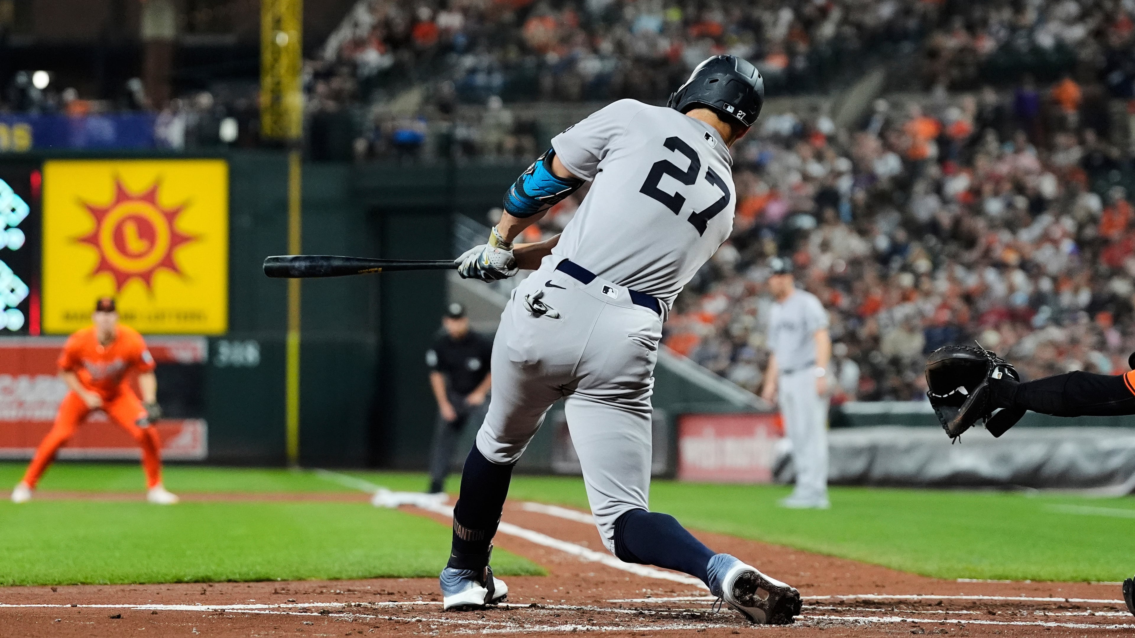 New York Yankees' Giancarlo Stanton hits a three-run home run during the first inning of a baseball game against the Baltimore Orioles, Saturday, Sept. 20, 2025, in Baltimore. (AP Photo/Stephanie Scarbrough)