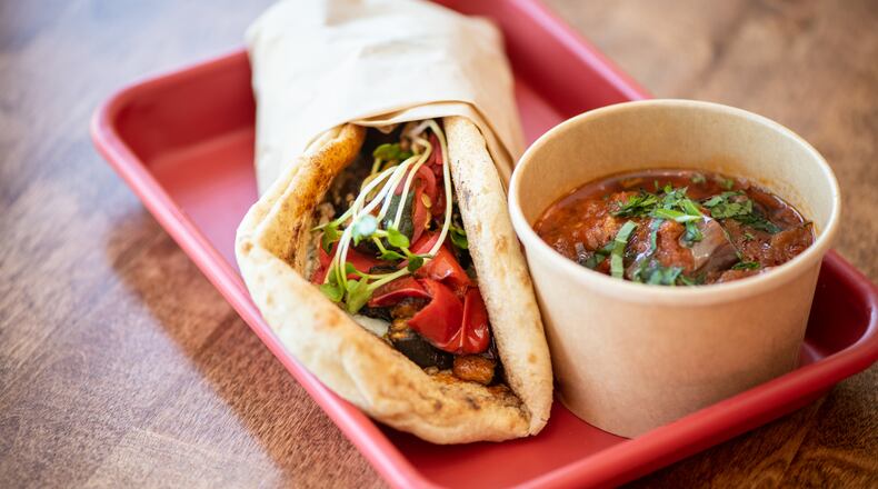 Karv Kitchen Horta wrap with spicy tzatziki, roasted zucchini, baby portabello mushrooms, red pepper, radish sprouts, quinoa, pickled red onoin, and radish. Photo credit- Mia Yakel.