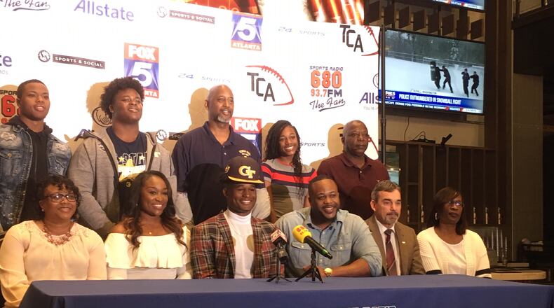 Georgia Tech signee Jamious Griffin at his college announcement Wedneday, February 6, 2019, at Sports and Social. Griffin is flanked by his mother LaBretha (left) and father Tyrone (right). Rome High coach John Reid is next to Tyrone Griffin. Griffin's brother Quon, a defensive lineman at Tech, is second from the left in the back row.