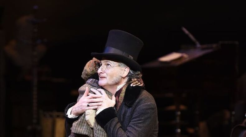 Actor David de Vries (Ebenezer Scrooge) and Jaden Robinson as Tiny Tim. De Vries said Jaden is a real joy to work with. He said Jaden is always open to thinking about the role in different ways. CONTRIBUTED BY GREG MOONEY / ALLIANCE THEATRE