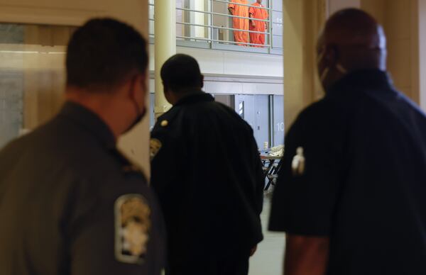 Fulton County Jail correction officers walk into the honors dorm on Thursday, March 30, 2023. Sheriff Patrick Labat says the inmates in this dorm worked together to deep clean the space so it is the cleanest in the jail. (Natrice Miller/ natrice.miller@ajc.com)