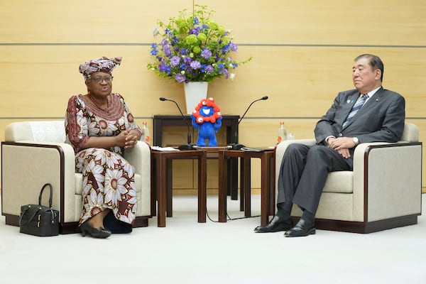 World Trade Organization (WTO) Director-General Ngozi Okonjo-Iweala, left, meets with Japan's Prime Minister Shigeru Ishiba at the latter's office in Tokyo Tuesday, May 13, 2025. (Kazuhiro Nogi/Pool Photo via AP)