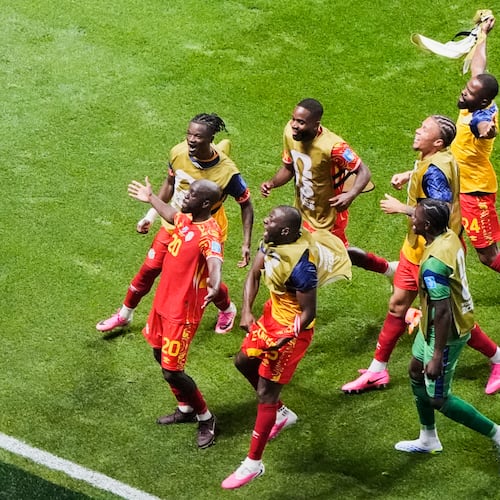Congo's Yoane Wissa (20) celebrates with teammates after scoring their third goal during the World Cup Group K soccer match between DR Congo and Uzbekistan in Atlanta, Saturday, June 27, 2026. (AP Photo/Mike Stewart)