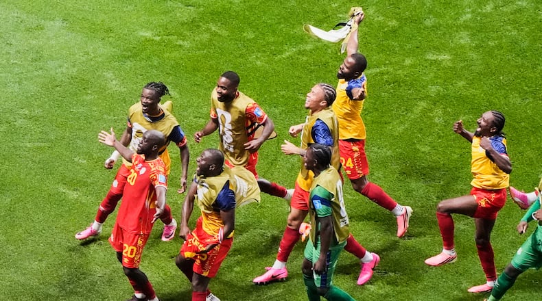 Congo's Yoane Wissa (20) celebrates with teammates after scoring their third goal during the World Cup Group K soccer match between DR Congo and Uzbekistan in Atlanta, Saturday, June 27, 2026. (AP Photo/Mike Stewart)