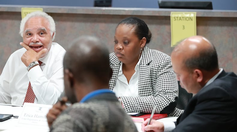 DeKalb County Elections Board members Samuel Tillman and (from left) Anthony Lewis, elections director Erica Hamilton, and Baoky Vu at a November 2018 meeting. Curtis Compton/ccompton@ajc.com