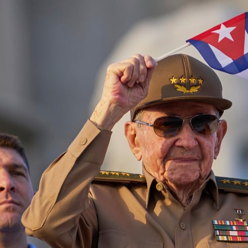 FILE - Raul Castro waves a Cuban national flag during a May Day parade at Revolution Square in Havana on May 1, 2025. (AP Photo/Ramon Espinosa, File)