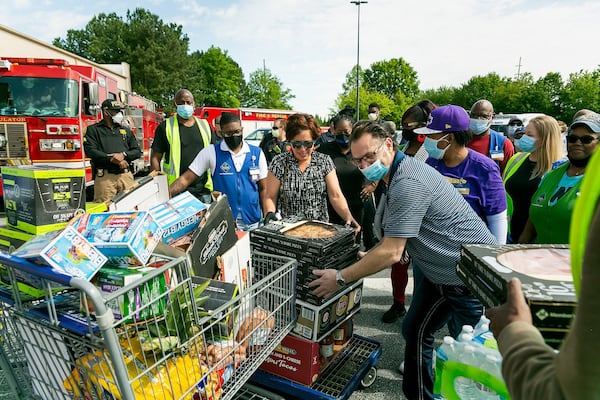 Stephanie Morales, of Pine Lake, exits Sam’s Club recently after the retailer donated more than $1,000 in food and supplies to her “Feeding the Front Lines” project, which provides free meals to first responders during the COVID-19 pandemic.(Photos: Cindy M. Brown)