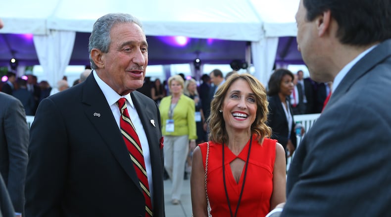 Falcons owner Arthur Blank and his wife Angie Macuga Blank greet guests as they arrive for the official groundbreaking ceremony of the new Falcons stadium at the Georgia International Plaza on Monday, May 19, 2014, in Atlanta. CURTIS COMPTON / CCOMPTON@AJC.COM