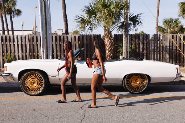 Attendees of Orange Crush in Tybee Island leave the beach on Saturday, April 19, 2025. (Natrice Miller/ AJC)