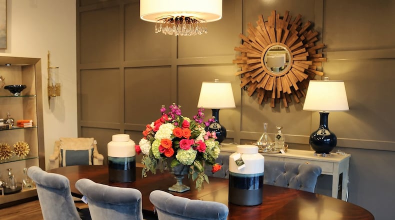 Vignettes like this dining room in Nandina help shoppers visualize how furniture, fabric, lighting and carefully placed accessories work together. Contributed by Nandina