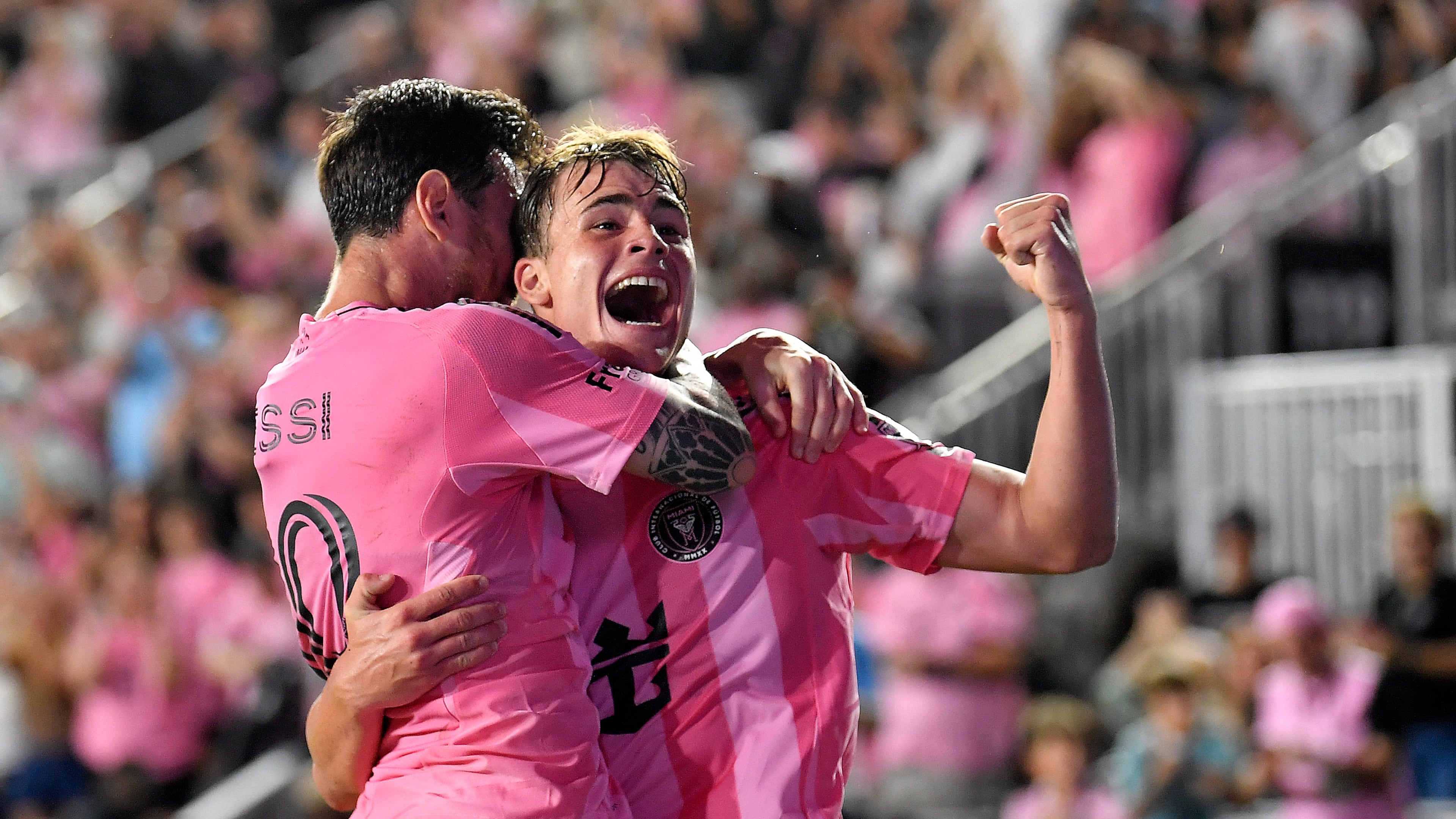 Inter Miami forward Lionel Messi, left, celebrates with forward Mateo Silvetti, right, after scoring during the first half of Game 3 in the first round of MLS soccer's Western Conference playoffs against Nashville SC in Fort Lauderdale, Fla., Nov. 8, 2025. (AP Photo/Michael Laughlin)