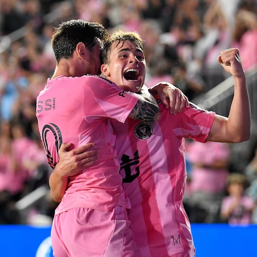 Inter Miami forward Lionel Messi, left, celebrates with forward Mateo Silvetti, right, after scoring during the first half of Game 3 in the first round of MLS soccer's Western Conference playoffs against Nashville SC in Fort Lauderdale, Fla., Nov. 8, 2025. (AP Photo/Michael Laughlin)