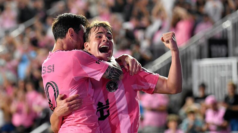 Inter Miami forward Lionel Messi, left, celebrates with forward Mateo Silvetti, right, after scoring during the first half of Game 3 in the first round of MLS soccer's Western Conference playoffs against Nashville SC in Fort Lauderdale, Fla., Nov. 8, 2025. (AP Photo/Michael Laughlin)