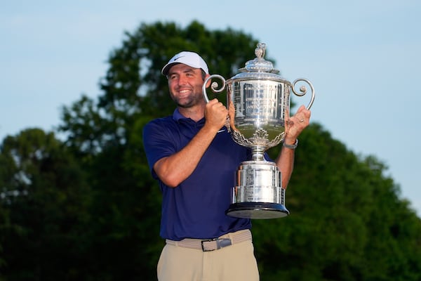 Scottie Scheffler holds the Wanamaker trophy after winning after winning the PGA Championship golf tournament at the Quail Hollow Club, Sunday, May 18, 2025, in Charlotte, N.C. (AP Photo/Matt York)