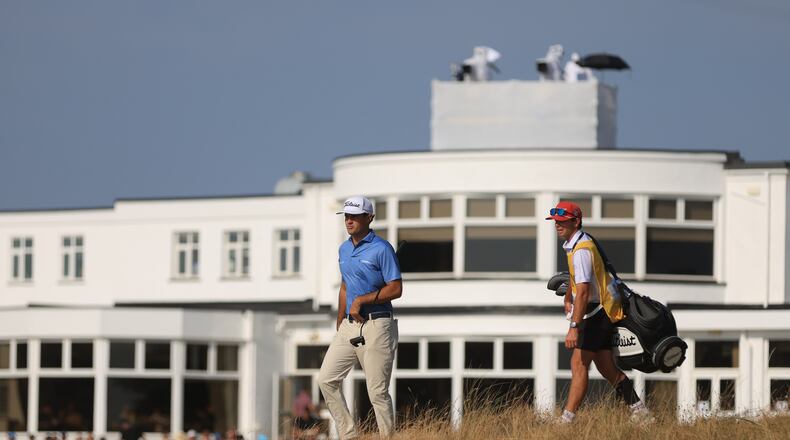 Jackson Suber of the United States, and his caddie Greyson Porter walks towards the 18th green during the first day of the British Open Golf championships at Royal Birkdale golf club, in Southport, England, Thursday, July 16, 2026. (AP Photo/Peter Morrison)