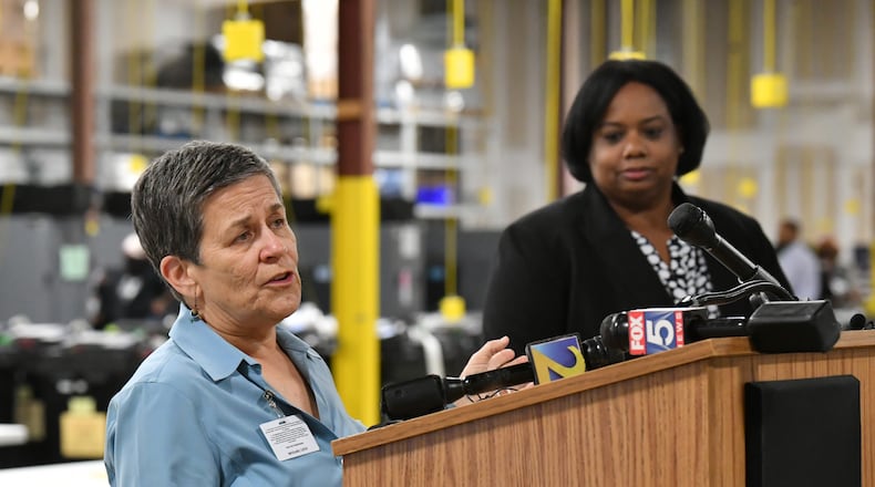 May 24, 2022 Atlanta - Cathy Woolard, chairwoman, speaks to members of the press as Nadine Williams (background), elections chief, looks at Fulton County Election Preparation Center on Tuesday, May 24, 2022. (Hyosub Shin / Hyosub.Shin@ajc.com)