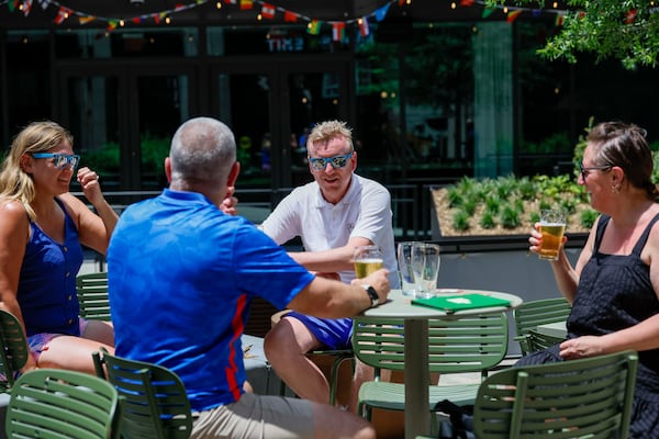 England fans visiting Atlanta for the 2026 FIFA World Cup enjoy the patio at the Irish Exit in South Downtown. (Miguel Martinez/AJC)