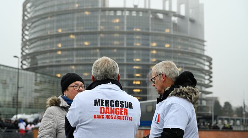 A protestor wears a shirt which reads "Mercosur-danger on our dinner plate" as he participates in a demonstration against the EU-Mercusor trade agreement, outside the European Parliament in Strasbourg, eastern France, Tuesday, Jan. 20, 2026. (AP Photo/Pascal Bastien)
