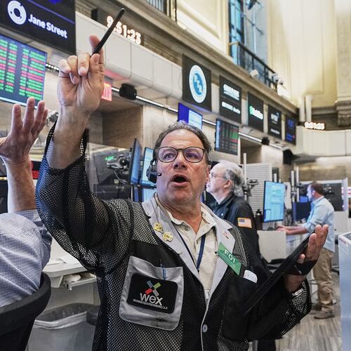 Options trader Anthony Spina, center, works on the floor of the New York Stock Exchange, Tuesday, June 16, 2026. (AP Photo/Richard Drew)