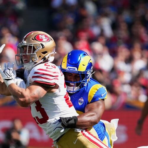 Los Angeles Rams linebacker Omar Speights breaks up a pass intended for San Francisco 49ers running back Christian McCaffrey during the first half of an NFL football game, Friday, Sept. 11, 2026, in Melbourne, Australia. (AP Photo/Scott Barbour)