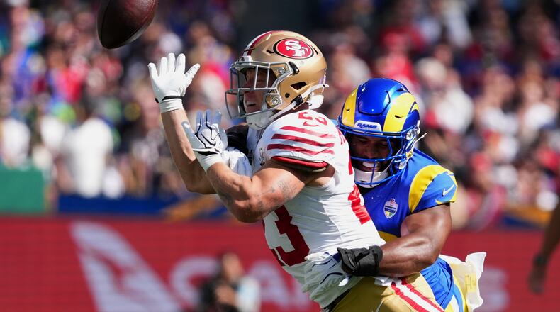 Los Angeles Rams linebacker Omar Speights breaks up a pass intended for San Francisco 49ers running back Christian McCaffrey during the first half of an NFL football game, Friday, Sept. 11, 2026, in Melbourne, Australia. (AP Photo/Scott Barbour)