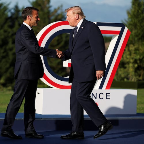 French President Emmanuel Macron greets President Donald Trump, right, during the official arrivals ceremony for the G7 summit in Evian-les-Bains, France, Monday, June 15, 2026. (Isabel Infantes, Pool Photo via AP)