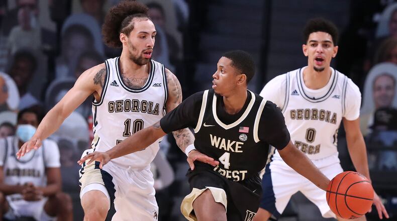 010321 ATLANTA: Georgia Tech guards Jose Alvarado (left) and Michael Devoe double-team Wake Forest guard Daivien Williamson during the first half Sunday, Jan. 3, 2021, at McCamish Pavilion in Atlanta. (Curtis Compton / Curtis.Compton@ajc.com)
