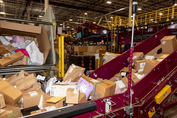 Mail is sorted as it moves through the United States Postal Service facility in Palmetto on Aug. 20, 2024. Louis DeJoy, the postmaster general, defended the 10-year plan to stabilize the agency’s finances, although he acknowledged that officials had faced initial challenges. (Kendrick Brinson/New York Times 2024)
                      