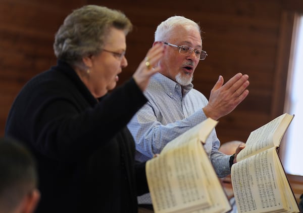Sacred Harp singers lead from the hollow square, a special formation in which singers, organize into four voice parts and face each other to create an open center, at Holly Springs Primitive Baptist Church in Bremen, Ga., on Saturday, March 22, 2025. (AP Photo/Jessie Wardarski)