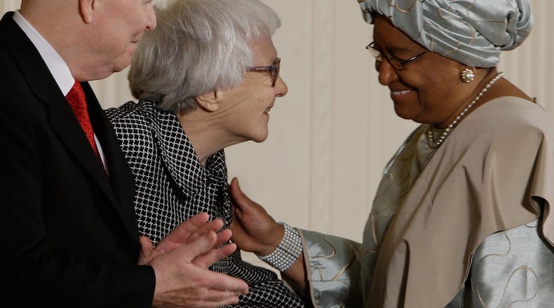 Presidential Medal of Freedom recipients, from left, C-SPAN President and Chief Executive Officer Brian Lamb, author Harper Lee, and Liberian President Ellen Johnson Sirleaf, chat as they take part in a ceremony honoring the 2007 Recipients of the Presidential Medal of Freedom, Monday, Nov. 5, 2007, in the East Room at the White House in Washington. (AP Photo/Ron Edmonds)
