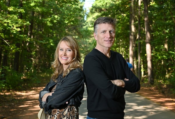 Taylor Scott (left) and Kevin Avery celebrated 20 years of "The Kevin & Taylor Show," on Silver Comet trail in Smyrna on Thursday, Oct. 1, 2020. (Hyosub Shin/AJC)