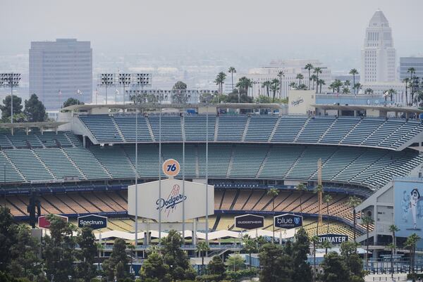 Dodger Stadium is shown before an evening baseball game on Friday, June 20, 2025, in Los Angeles. (AP Photo/Damian Dovarganes)
