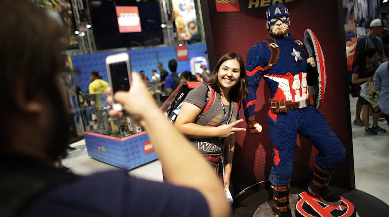 Danah Hernandez is photographerd by Gonzalo Glicia next to a Lego sculpture of Captain America at the Comic Con International in San Diego in July 2016. San Diego Comic-Con International will open a museum of popular culture in nearby Balboa Park. (Robert Gauthier/Los Angeles Times/TNS)