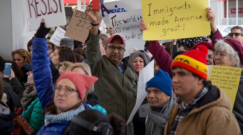 Protesters chant and hold up signs showing their opposition to President Trump’s travel ban at Hartsfield-Jackson Atlanta International Airport January 30, 2017 STEVE SCHAEFER / SPECIAL TO THE AJC