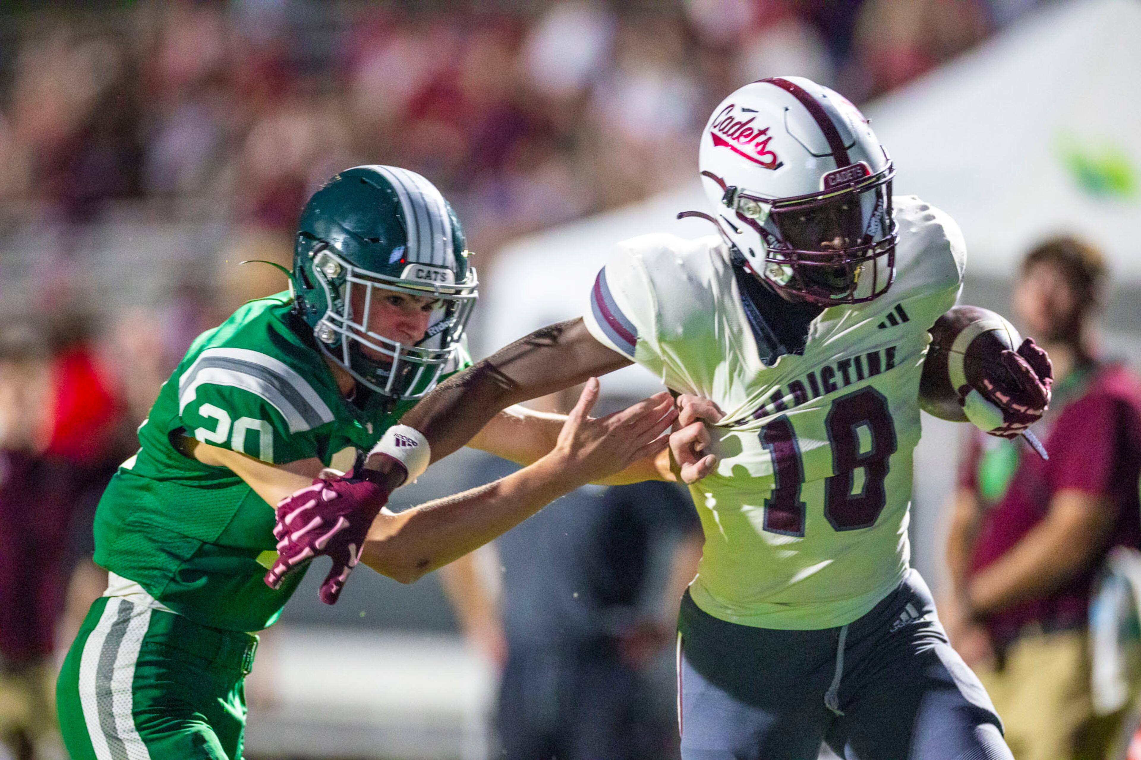 Benedictine player Ca'ron Hall (18) holds back #20 and runs for a touchdown against Westminster at Fritz Orr Field in Atlanta, GA on Friday, Sept. 19th, 2025. (Oscar Guevara Saenz for the AJC)
