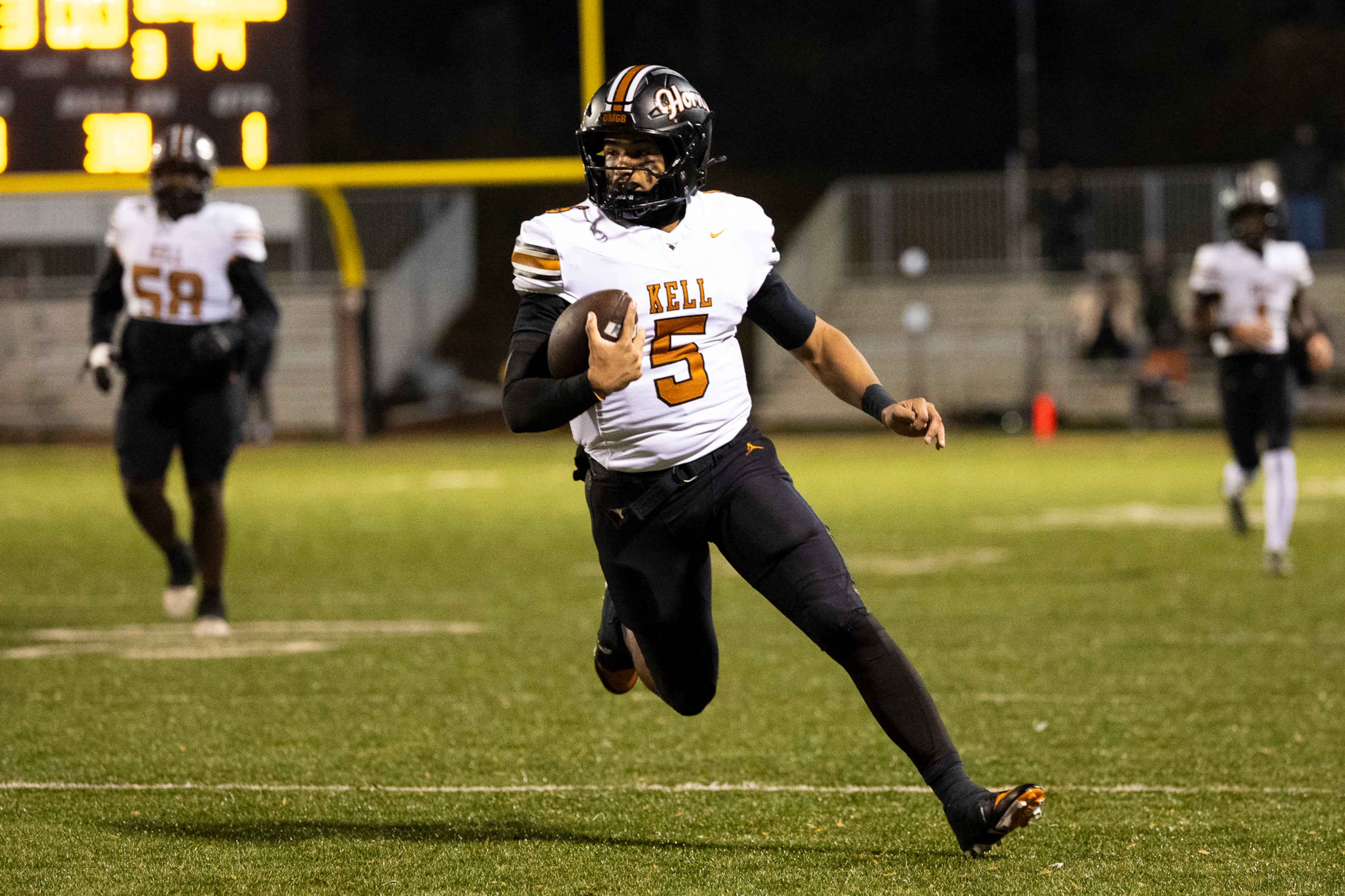 Kell quarterback Kaleb Narcisse (5) runs with the ball during the first half of the class 4A semifinal against Creekside at Creekside High School in Fairburn, GA on Friday, December 5, 2025. (Oscar Guevara Saenz for the AJC)