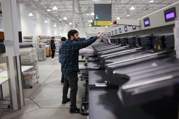 FILE - An employee sorts ballots at Los Angeles County Election Center on Election Day, Nov. 5, 2024, in City of Industry, Calif. (AP Photo/Etienne Laurent, File)