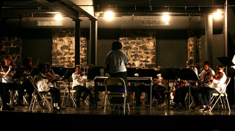 Local students participate in one of Atlanta Music Project's first orchestra concerts in 2011.