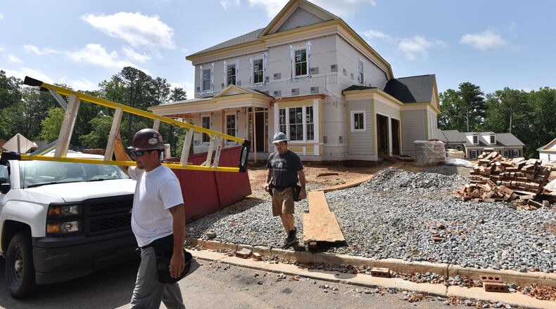 Work underway last summer on a 4,700 square foot house in Goulding Historic Roswell. The Atlanta market is moving in different directions, with shortages of smaller, more affordable properties for first-time buyers and a big supply of higher-priced homes.HYOSUB SHIN / HSHIN@AJC.COM