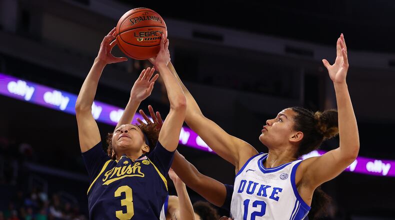 Notre Dame guard Hannah Hidalgo (3) shoots against Duke forward Delaney Thomas (12) during the first half of an NCAA college basketball game in the semifinals of the Atlantic Coast Conference tournament, Saturday, March 7, 2026, in Duluth, Ga. (AP Photo/Colin Hubbard)