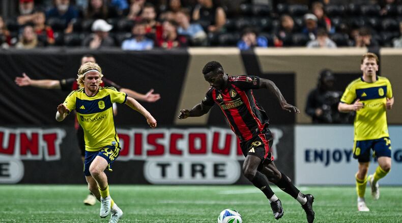 Emmanuel Latte Lath, dribbling during a match against Nashville SC, was acquired by Atlanta United in the offseason for an MLS-record $22 million from Middlesbrough in England’s Championship. (Julian Alexander/Atlanta United)