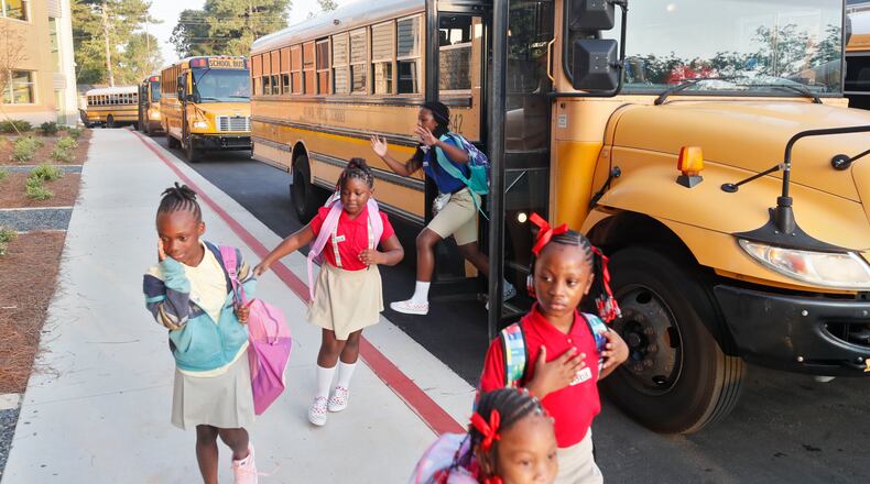 Atlanta Public Schools students arrive for the first day of the 2019-2020 school year at Tuskegee Airmen Global Academy. (Bob Andres / AJC FILE PHOTO)