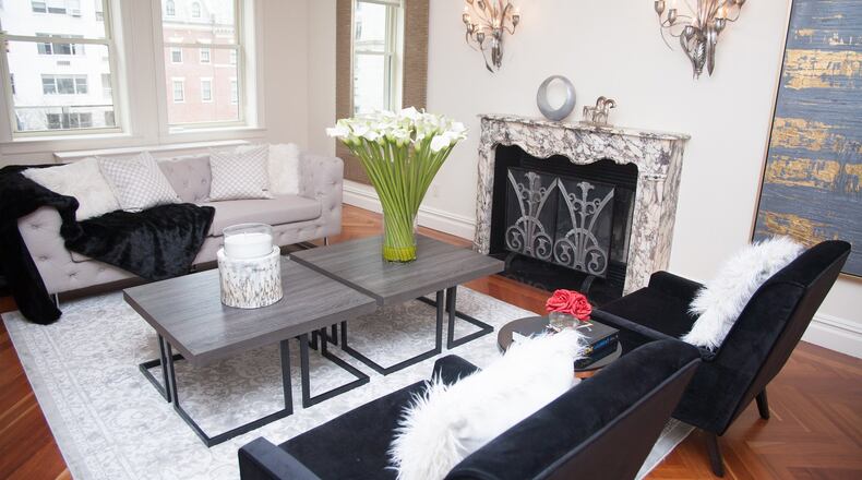 Tall artificial calla lillies create a focal point in this space. (Hanna Rokes)