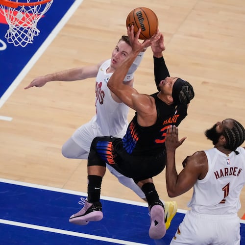 New York Knicks guard Josh Hart (3) is blocked by Cleveland Cavaliers guard Sam Merrill (5) during the second half of Game 2 in the Eastern Conference finals NBA basketball playoffs series, Thursday, May 21, 2026, in New York. (AP Photo/Yuki Iwamura)