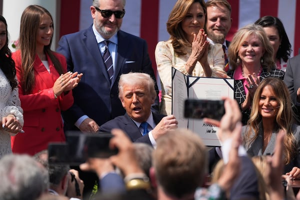 President Donald Trump, with first lady Melania Trump and others, after signing the "Take It Down Act" during a ceremony in the Rose Garden at the White House, Monday, May 19, 2025. (AP Photo/Manuel Balce Ceneta)