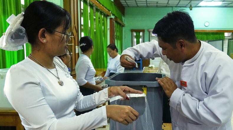 Official of the Union Election Commission prepare to close a polling station after the votes are counted, during the first phase of general election, in Naypyitaw, Myanmar, Sunday, Dec. 28, 2025. (AP Photo/Aung Shine Oo)