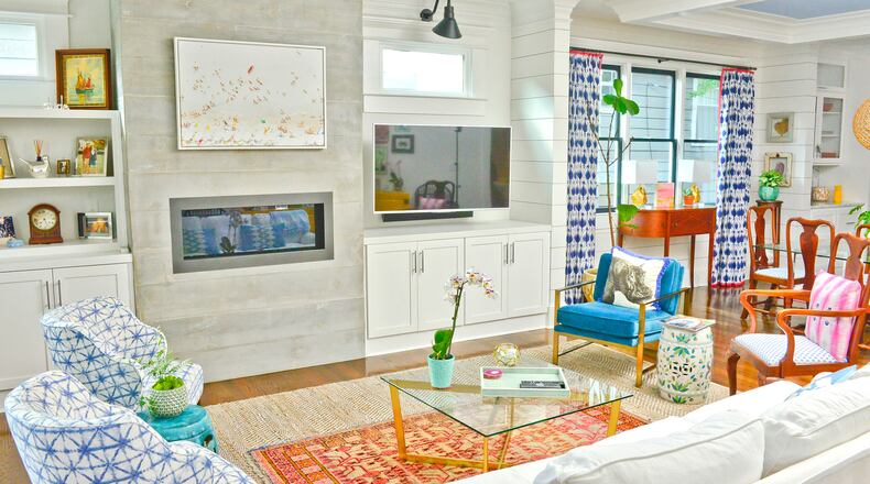 The coffee table in this bright living space is from West Elm, as are most of the pillows and lamps throughout the house. By keeping her walls light and neutral, homeowner Grace White incorporated multiple colors and patterns without clashing. “You can still have white walls and still have tons of color,” White says. Text by Lori Johnston and Shannon Adams/Fast Copy News Service. (Christopher Oquendo Photography/www.ophotography.com)