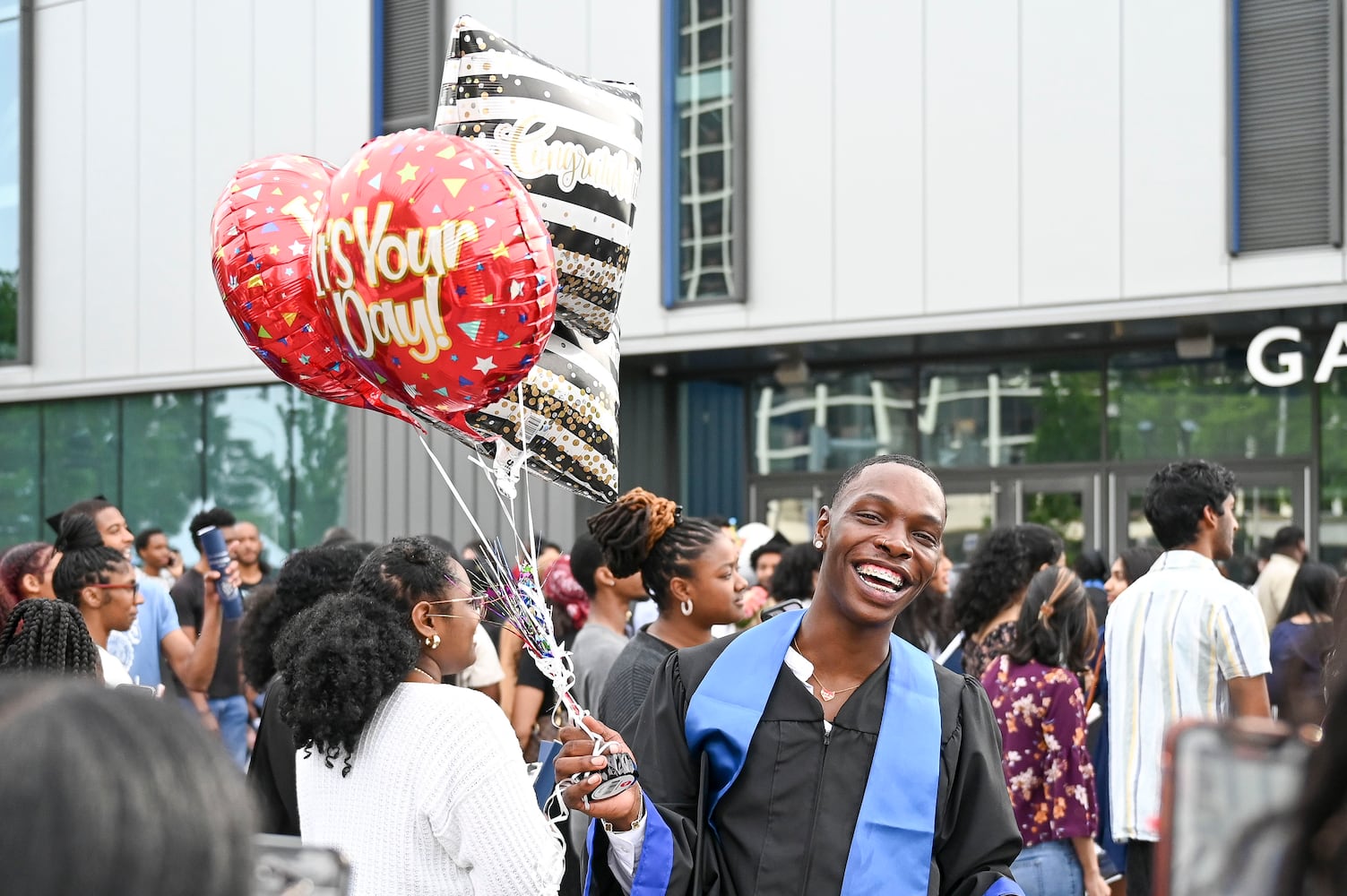 Graduate Xavier Threatt celebrates with friends and family members at the conclusion of Georgia State University’s Spring commencement ceremony for the College of Arts & Sciences Wednesday, May 7, 2025 in Atlanta. (Daniel Varnado/For the Atlanta Journal-Constitution)