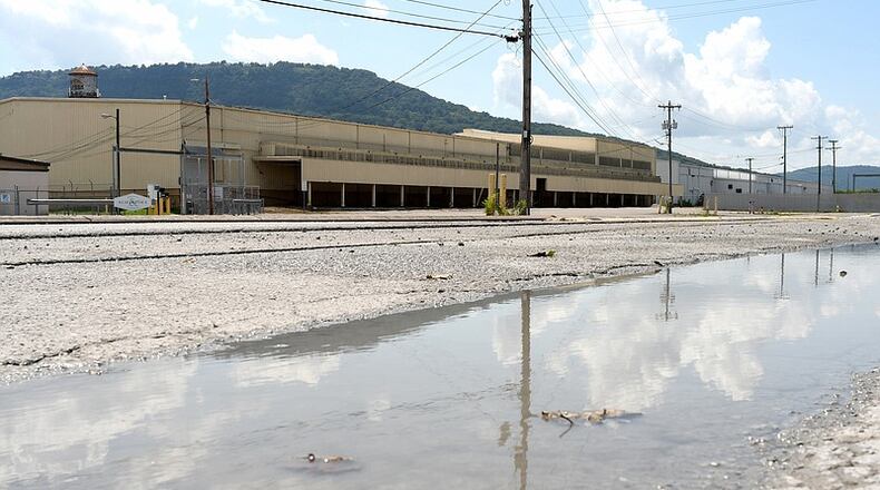 A puddle lingers along the edge of Alton Park Boulevard, just off Market Street, in Chattanooga, Tennessee. The Alton Park area is a victim of the urban heat island effect, a phenomenon where dense concrete development in tandem with limited tree canopy causes an area to be warmer than it would be. (Photo Courtesy of Robin Rudd)
