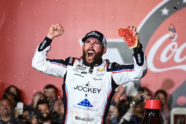 Ross Chastain celebrates in Victory Lane after winning a NASCAR Cup Series auto race at Charlotte Motor Speedway, Sunday, May 25, 2025, in Concord, N.C. (AP Photo/Matt Kelley)